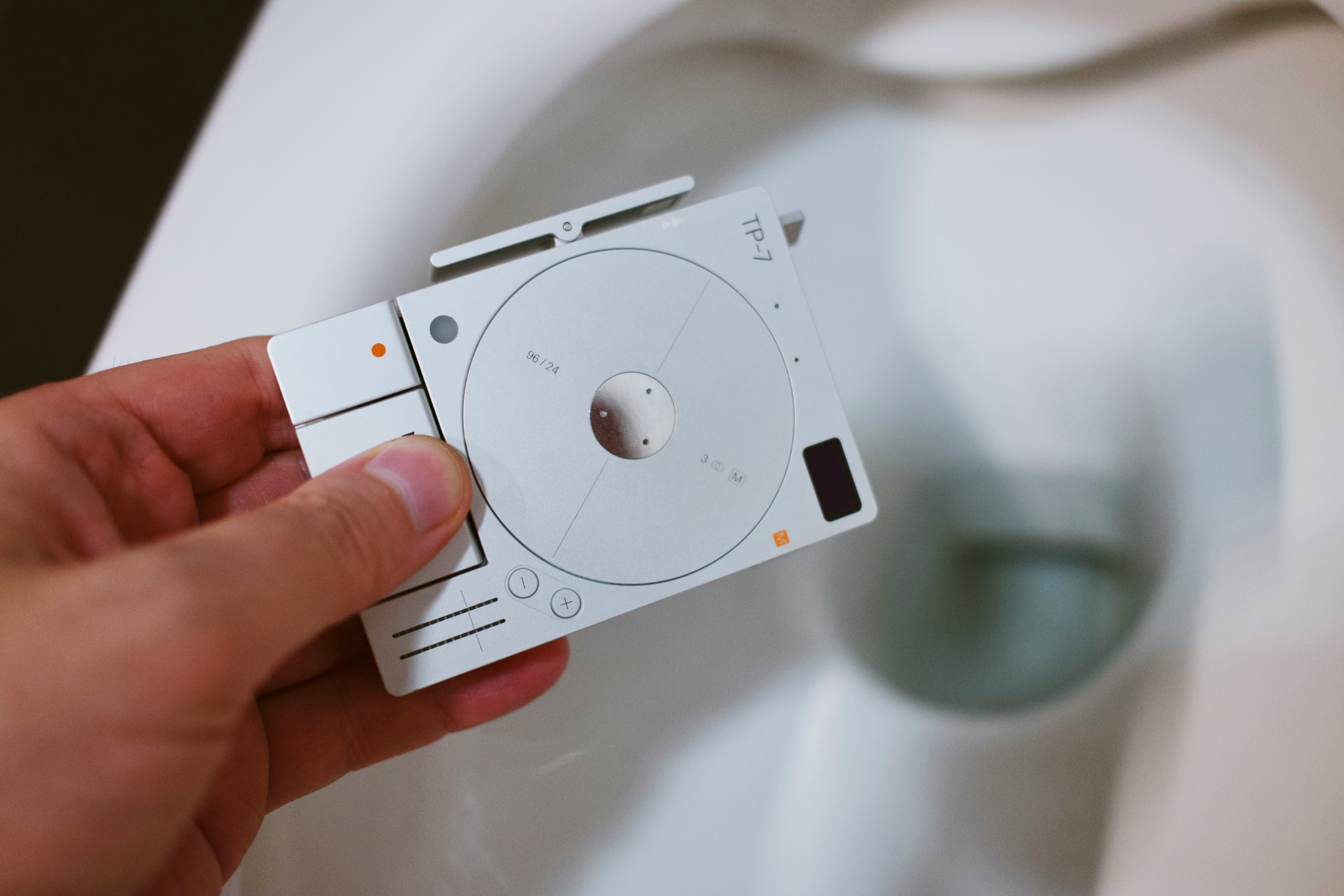 A modern office setting with people discussing financial data on screens.